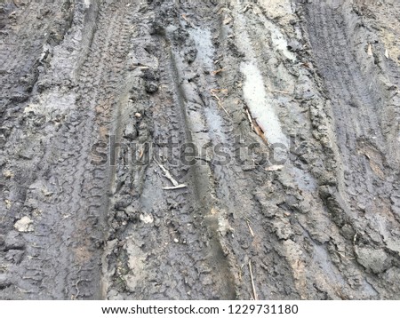 gravel texture. gravel background. Wheel track on mud. Tyre track on dirt sand or mud, retro tone, grunge tone, drive on sand, off road track.