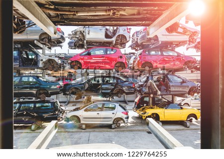 Recycling of old,used, wrecked cars. Dismantling for parts at scrap yards and sending for remelting. Royalty-Free Stock Photo #1229764255