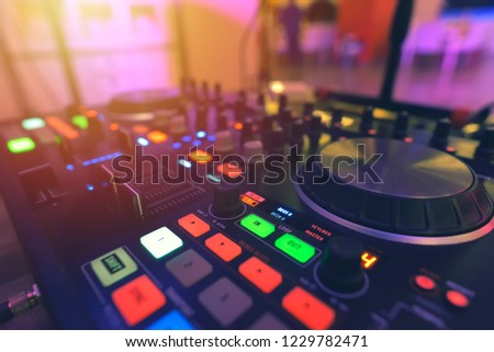 DJ mixer controller panel for playing music and partying in a nightclub