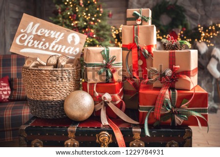 Marry Christmas and happy New Year celebration. Family gifts boxes and design home decor.