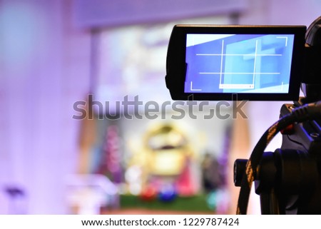 Video camera operator working, shooting on stage