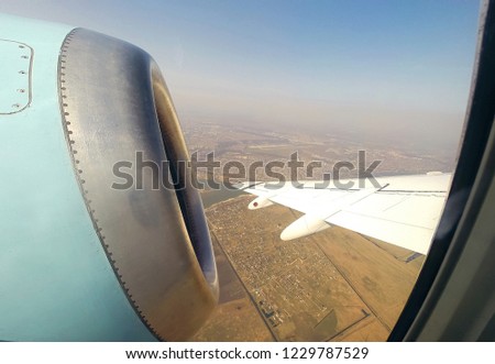 photo through the porthole of an airplane