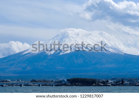 Beautiful Mount Fuji with snow capped and blue sky at Lake kawaguchiko, Japan. landmark and popular for tourist attractions