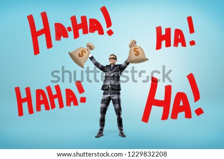 A happy businessman in a striped jail suit and a mask holds money bags above his head near large words Ha-Ha. Happy and rich. Stolen money. Loads of cash.