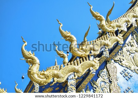 gold nakas statue at blue temple, wat rong sua ten, chaingrai ,Thailand 