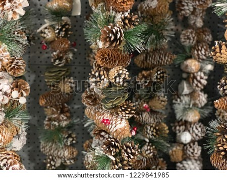 Close-up of Christmas rustic decorations, garlands, pine cones.