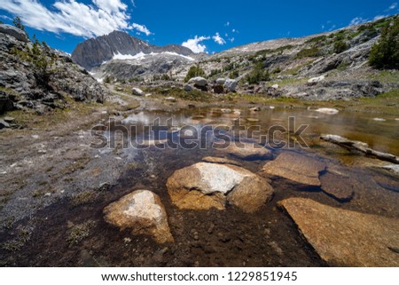 Shallow pond along the 20 Lakes Basin hiking trail in California Eastern Sierra Nevada mountains, Wide angle view