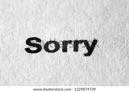 The word Sorry on white paper in the macro mode