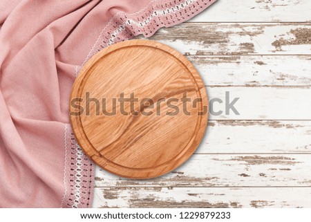 Table cloth and pizza board on vintage wooden table. Top view mock up