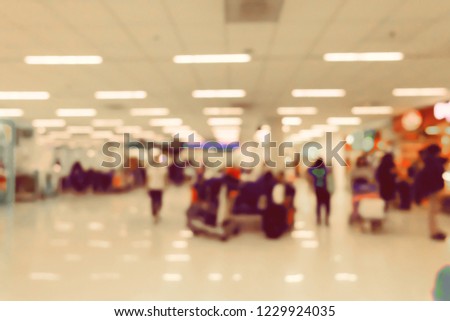 Abstract view of blurred airport terminal interior for background.