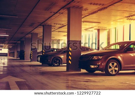 Parking in a residential building. Covered underground parking for cars