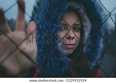 Girl posing on the street, a student in street clothes in the winter. street style. emotional portraits