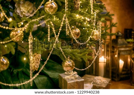 Christmas tree decorated with golden balls and cones