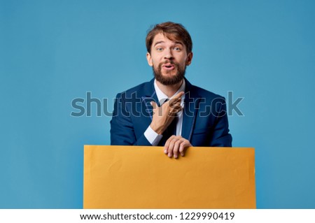  emotional man in a suit with an orange sheet of paper Poster mockup                              