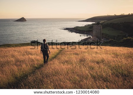 Walking on the South West Coastal path at sunset