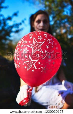 Young woman with a long hair and a balloon