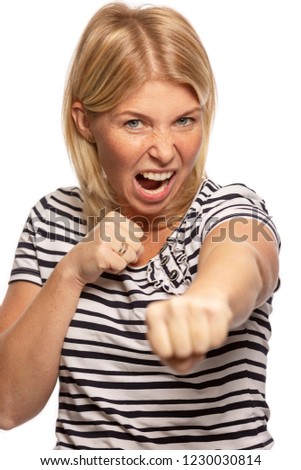 Beautiful woman in fighting stance, close-up