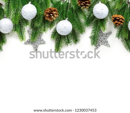 Christmas tree branches with decoration isolated on white background. Seamless New Year's Card