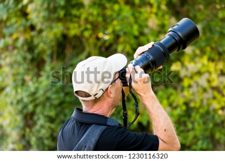 Man photographed with a telephoto lens in nature