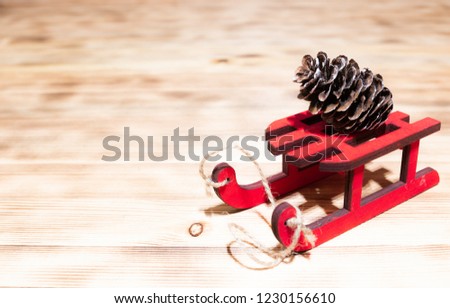 Holidays, gifts, new year and celebration concept - red wooden sledge with bump and backgrounds background. space for text