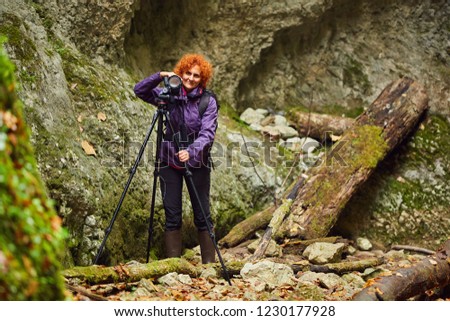 Female tourist taking photos of the beautiful gorge