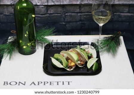 taco dinner with a glass of wine