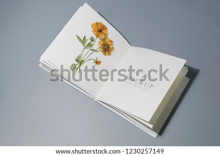 Mid fold book mockup with floral illustration