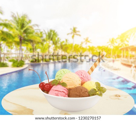 Ice cream scoops in bowl with wafer on white background