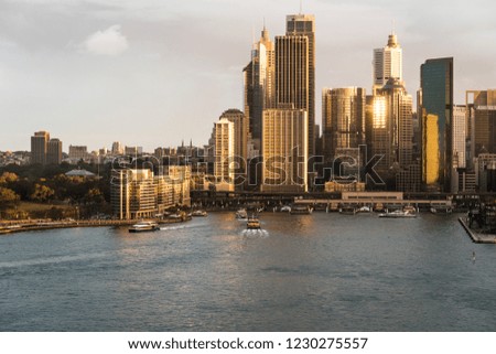 Stunning aerial view of the sunset over the Sydney business district skyline and the Circular Quay harbor in the Sydney bay in Australia largest city.