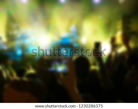 Blurred abstract background. Bokeh lighting in concert with audience