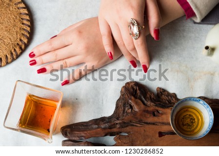 A picture of a girl's hand in jewelry