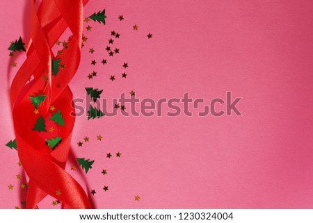 Red ribbon and confetti New year background with copy space