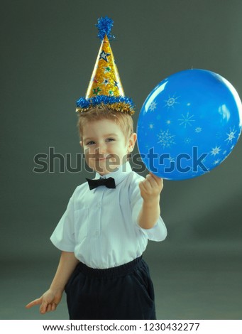 Adorable boy celebrating the birthday air balloon