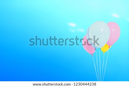 ballons on blurred blue sky with cloud background, holiday concept