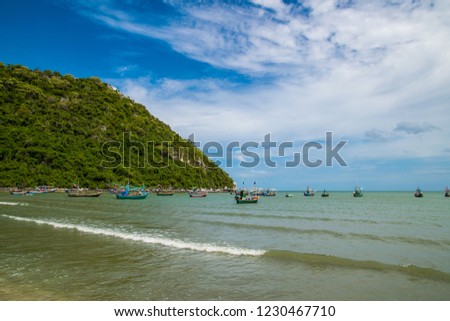 Long-tailed boat on beach
