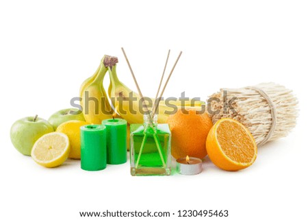 Still life of tropical fruits, essential oils and aroma diffuser.