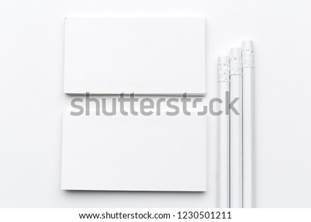 White blank business card. Office table desk with pencil. Top view and copy space for ad text