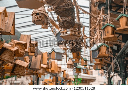 Tree wooden birds house in cage hanging at the market.Use for decorate your garden, cute and rustic decoration.
Romantic Paris market.