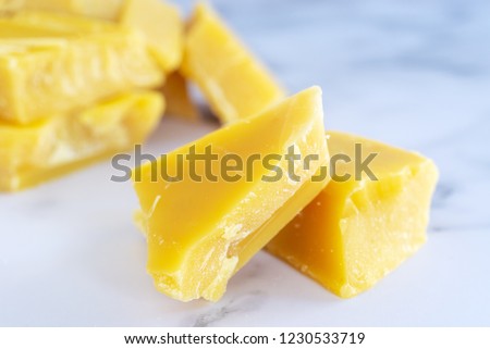 pure organic yellow beeswax for homemade natural  beauty and D.I.Y. project. Royalty-Free Stock Photo #1230533719