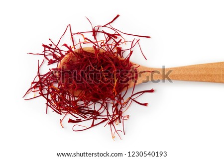 Saffron spice threads (strands) in wooden spoon isolated on white background Royalty-Free Stock Photo #1230540193
