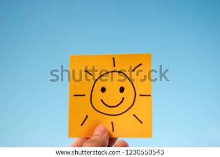 Happy sun yellow sticky note with blue sky background. Concept of happy summer. 