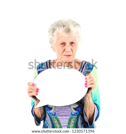 Angry old woman holding a blank word bubble against a white background