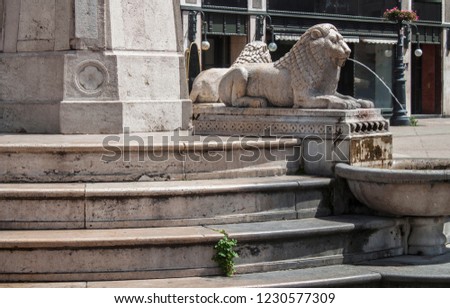 Detail of the ancient Lion Fountain in Vörösmarty Square, in the old town of Budapest, Hungary, Eastern Europe. 