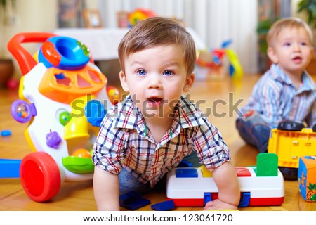 curious baby boy studying nursery room Royalty-Free Stock Photo #123061720