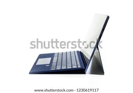 Compact laptop  tablet opened exposed keys pure white background blue key pad