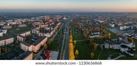 Aerial view of the city at sunset. Beautiful autumn city landscape. Aerial panorama.