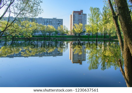 Reflection of trees and houses in the water