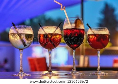 Cocktail drinks on a bar table.