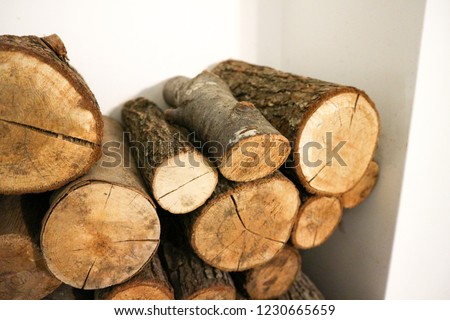 Stack of wood next to the fireplace.Firewood                               