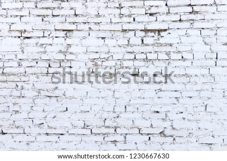 Texture of old red brick wall covered with white paint. White brick wall and masonry. Grunge background and wallpaper with space for text or image. Empty template and mockup for designers.